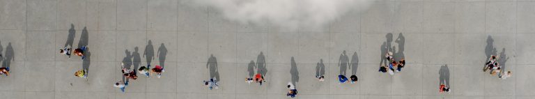 arial view of people and their shadows in a public space