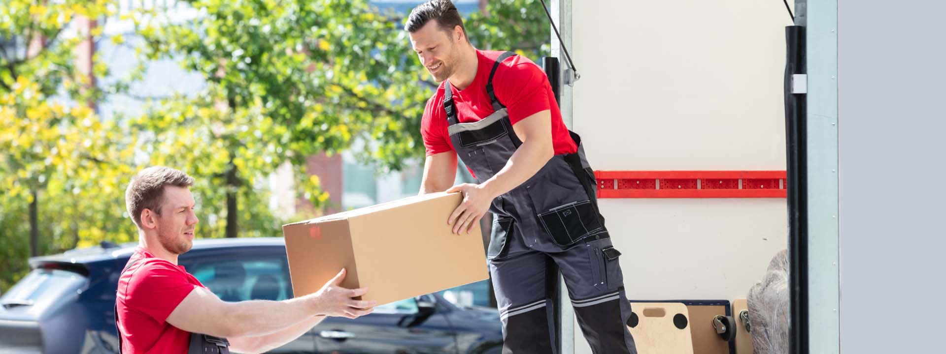 person handing box to another person